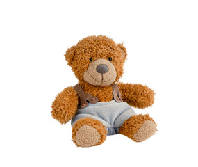 Furry toy gift in shape of brown teddy bear wearing light blue sling pants isolated on white background