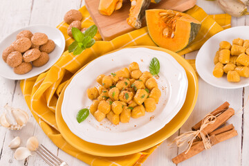Pumpkin gnocchi with grated amaretti cookies.