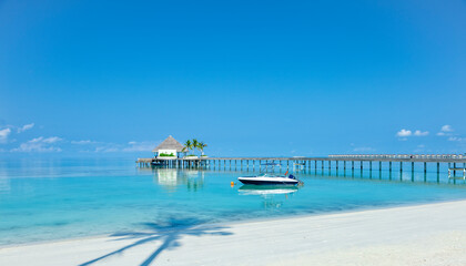 Wooden pier over blue sea water, summer tropical concept