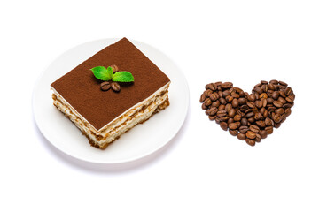 Traditional Italian Tiramisu square dessert portion on ceramic plate and heart shape made of coffee beans isolated on white background with clipping path