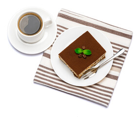 Traditional Italian Tiramisu dessert square portion on ceramic plate and cup of fresh espresso coffee isolated on white background with clipping path