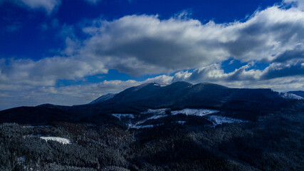Carpathian mountains mountain range pine forests coniferous mountain tops winter snow aerial photography