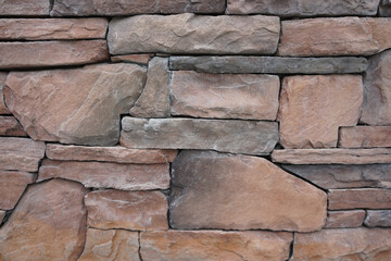 Sandstone rock stone wall background.