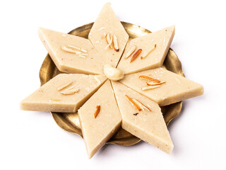Kaju katli / kaju barfi is a diamond shape indian sweet made with using cashew stock image. 
