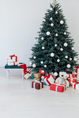 New Year's card interior red decor and Christmas tree with white gifts