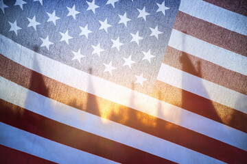 Fototapeta na wymiar Sunlight shining through of an American flag in the morning. Closeup. 