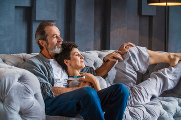 elderly couple sitting on the sofa