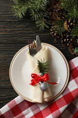 Concept of New year table setting with spruce branches on wooden background
