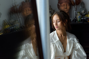 Portrait of a beautiful young woman. The woman looks to the side.