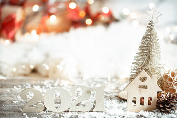Light christmas background with wooden number 2021 close up.