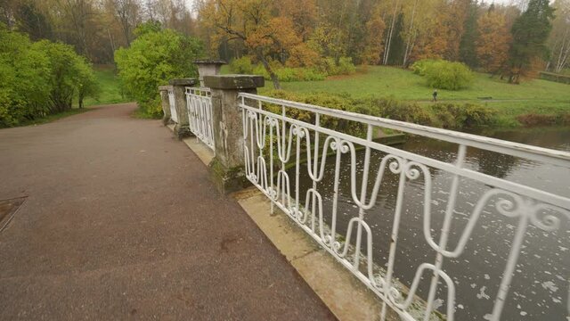 Pavlovsk park in autumn, St. Petersburg, Visconti bridge spanning the Slavianka river
