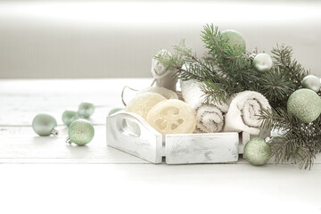 Spa composition with Christmas decoration on light blurred background copy space.