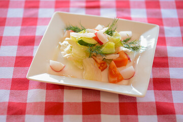 Dietary salad with vegetables, radish, tomatoes and sauce. Traditional Italian cuisine, Italian concept.
