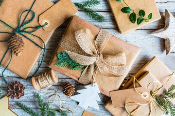 Christmas eco gift decorations on wooden background. Zero waste trend. 