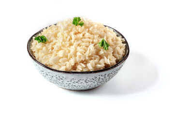 A bowl of white rice with fresh parsley leaves on a white background