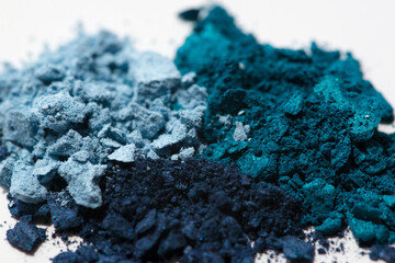 Blue tiny eye shadow on a white background