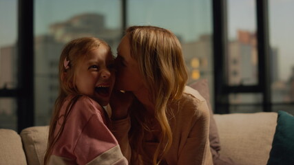 Mom kid spending time together. Mother and daughter making each other laugh.