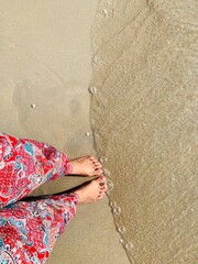 Fototapeta na wymiar Feet on the beach