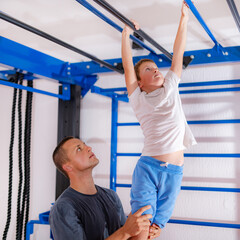 Fototapeta premium Physical activity for children, monkey bar exercise