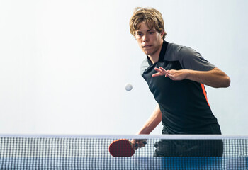 Young sportsman playing table tennis