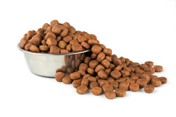 Full dog or cat food on stainless dish on white background for design about pet shop. Animal and pet concept.