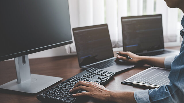 Programmer working in a software development and coding technologies. Website design. Technology concept.