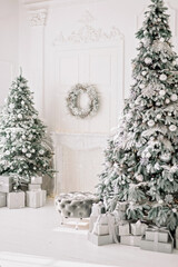 Festive interior. Luxurious Christmas tree decorated with lights with gifts. Happy New Year 2021. Christmas concept. Soft selective focus. Copy space.