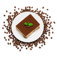 Traditional Italian Tiramisu square dessert portion on ceramic plate and coffee beans isolated on white