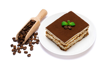 Fototapeta na wymiar Traditional Italian Tiramisu square dessert portion on ceramic plate and coffee beans isolated on white background with clipping path