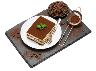 Traditional Italian Tiramisu square dessert portion on ceramic plate, strainer and coffee beans on stone serving cutting board isolated on white