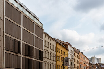 Apartment buildings in central Berlin. Low angle view against sky with tram wires