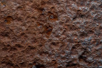 Background with an old metal surface with rust. Photo with soft focus and blurred backdrop at high magnification.