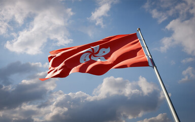 Hong Kong national flag waving at sky background close-up.