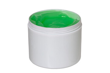 Closeup oft a opened plastic jar or container with green cooling gel (horse balm) for sports injuries or aloe vera cosmetic gel isolated on a white background. Empty space. Macro.