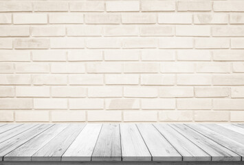 Empty wooden table top on cream brick wall background, Design wood terrace white. Perspective for show space for your copy and branding. Can be used as product display montage. Vintage style concept.