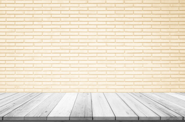 Empty wooden table top on cream brick wall background, Design wood terrace white. Perspective for show space for your copy and branding. Can be used as product display montage. Vintage style concept.
