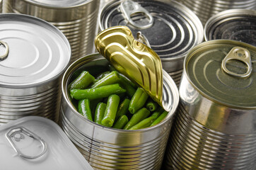 Canned green beans in just opened tin can. Non-perishable food