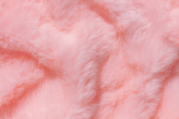 Pink fur texture top view. Coral fluffy fabric coat background. Winter fashion color trends feminine flat lay, female blog backdrop for text signs desidgn. Girly abstract wallpaper, textile surface.