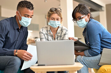Business people meeting with face masks in the office