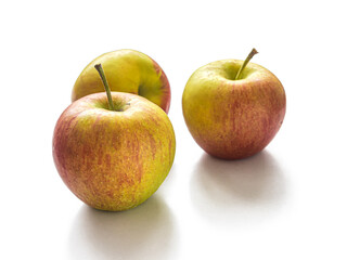 Seasonal red-yellow apples on a white background