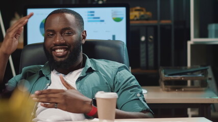 Fototapeta premium Closeup smiling african american businessman having fun in hipster office