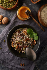 Healthy breakfast, seed and nut mix with honey and mint