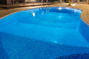 Fototapeta na wymiar Blue water swimming pool close up view.