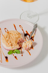 Delicious appetizing panna cotta dessert on a white table with glasses of champagne.