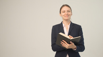 woman in a jacket with a notebook