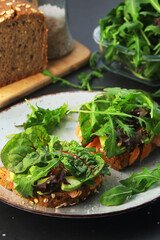 Sandwiches with salmon, avocado and salad