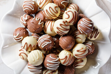 Chocolate truffles balls on a white platter