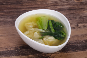 Asian traditional Wonton soup with herbs