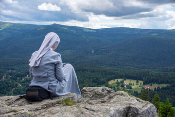 Nun reads the bibles in the mountains - Christian contemplation