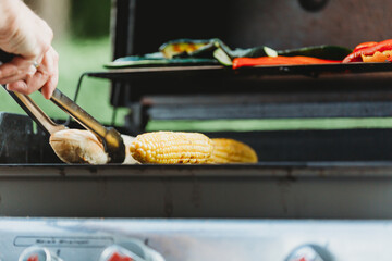 chef preparing food with an outdoor grill